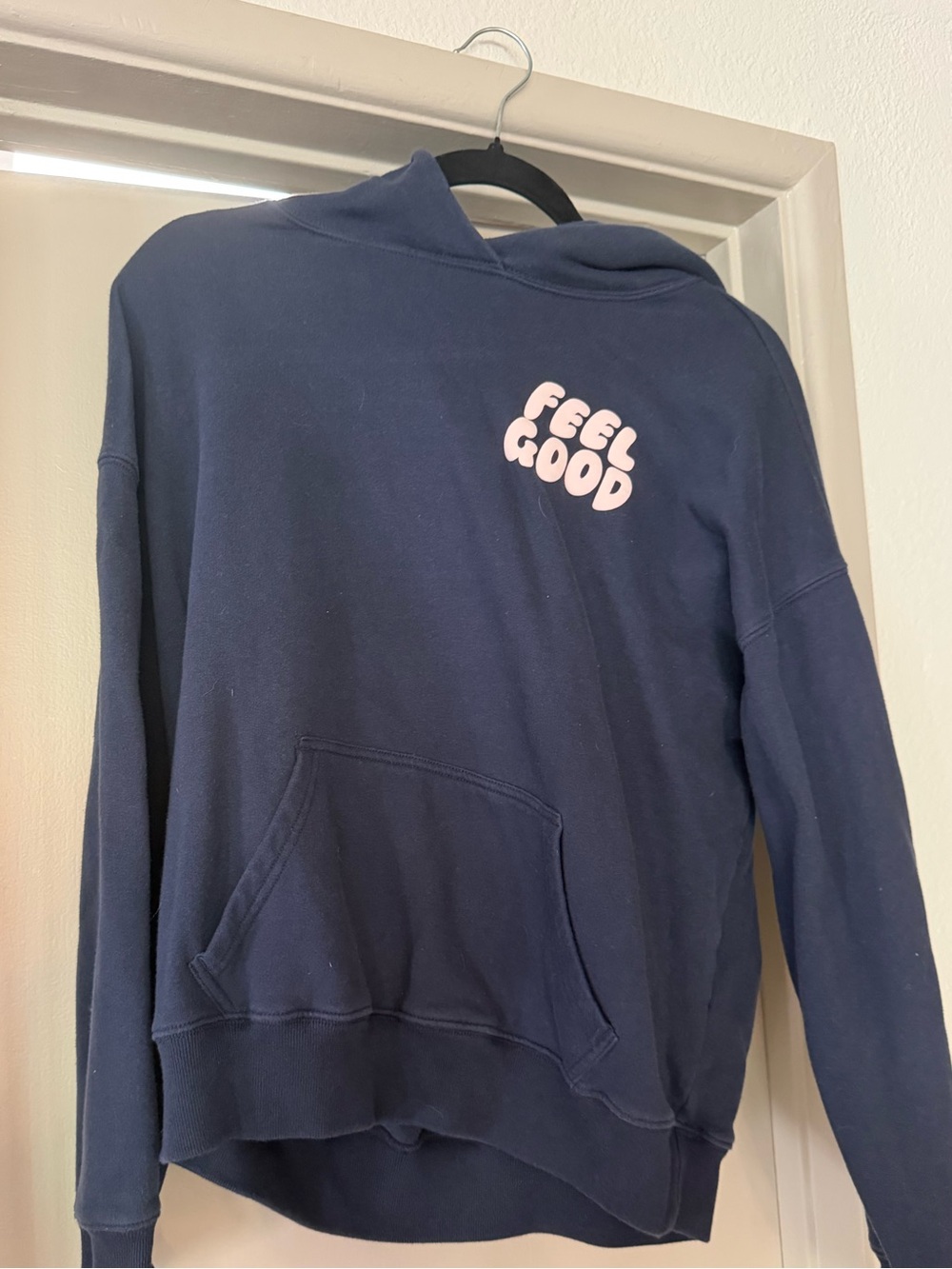 Hollister Navy Blue Hoodie with Pink "Feel Good" Graphic